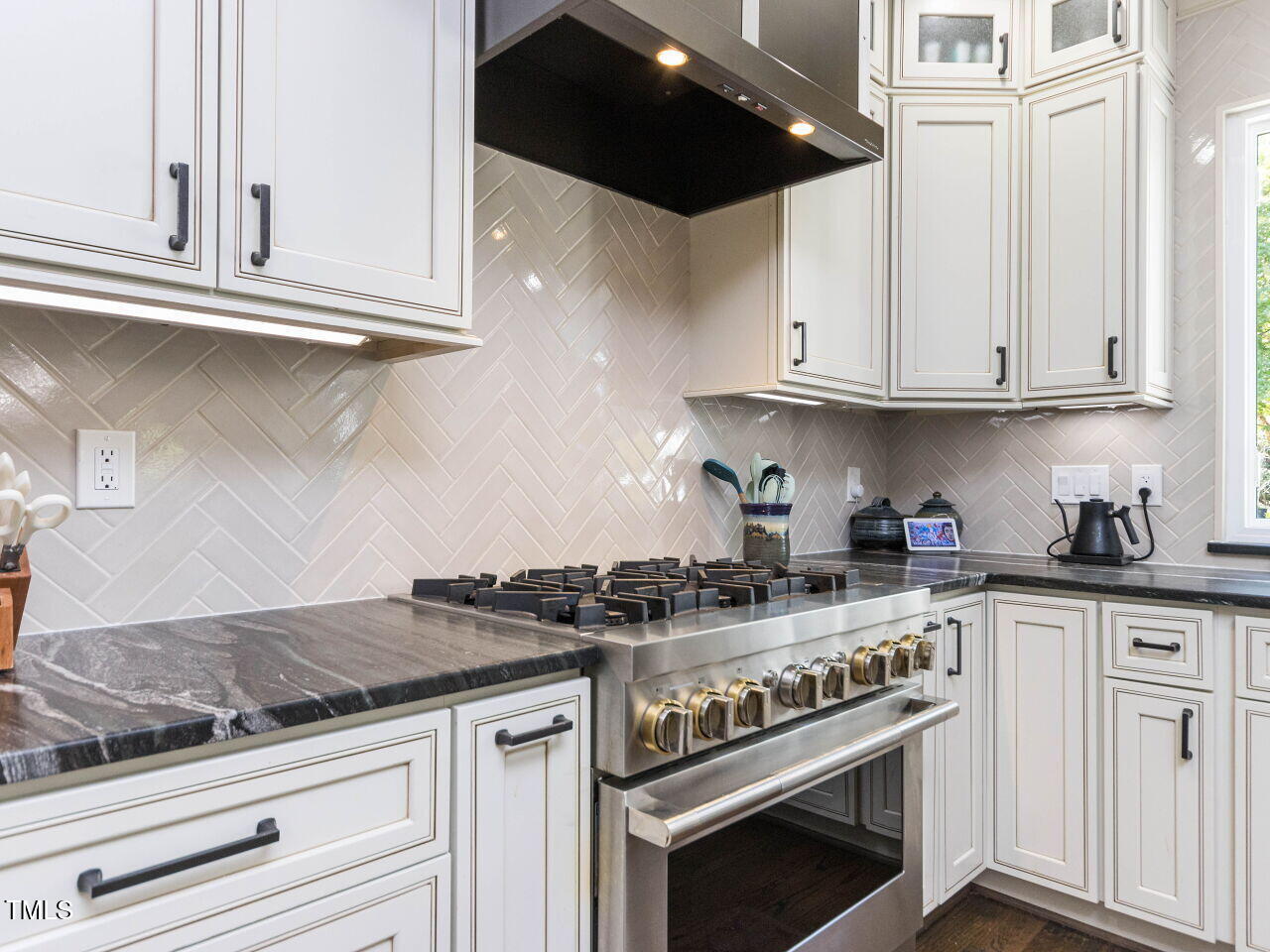 1201 Kalworth Road Wake Forest, NC 27587 - Photo 8 of 76 a kitchen with granite countertop white cabinets and stainless steel appliances