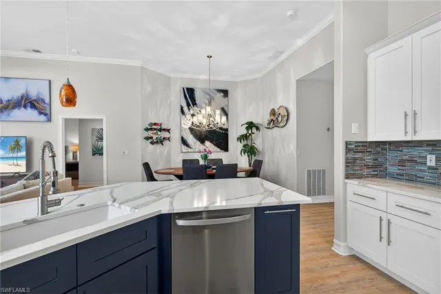 a kitchen with a sink and a refrigerator