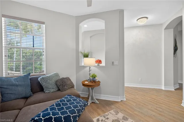 a living room with furniture and a window