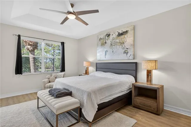 a bedroom with a bed couch and window