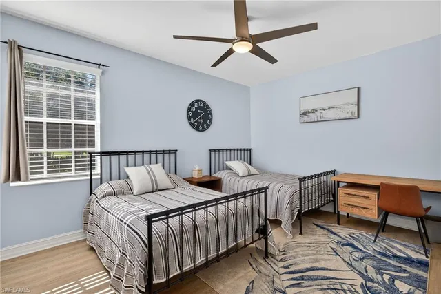 a bedroom with bed and a window