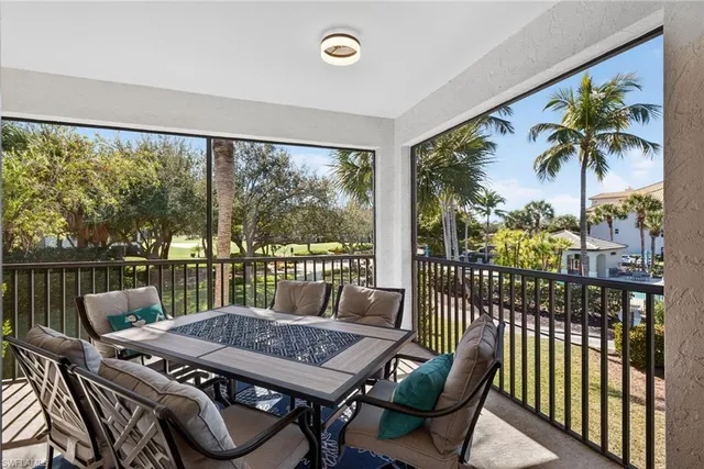 a view of a balcony filled with furniture