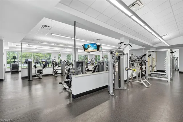 a view of a room with lots of gym equipment
