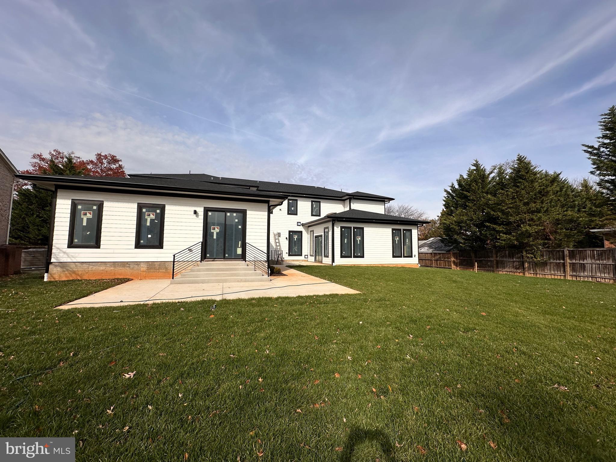 2113 Chain Bridge Road Vienna, VA 22182 - Photo 4 of 10 front view of a house with a big yard