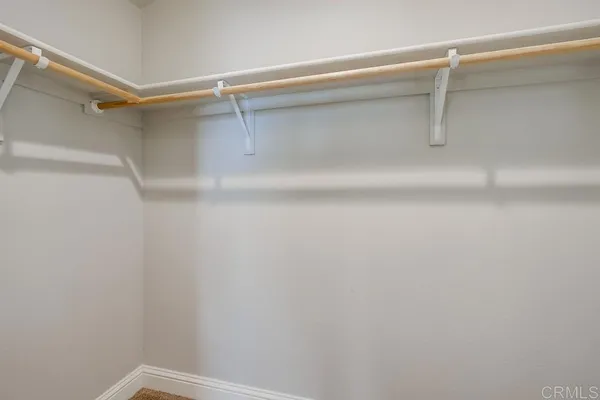 a view of an empty walk in closet