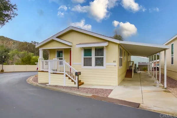 a front view of a house with a patio