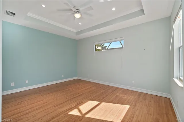 an empty room with a workspace and a window