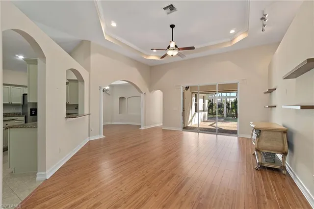 a view of livingroom with hardwood floor and a ceiling fan