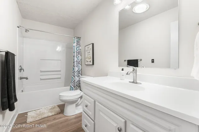 a kitchen with stainless steel appliances a stove microwave and a refrigerator