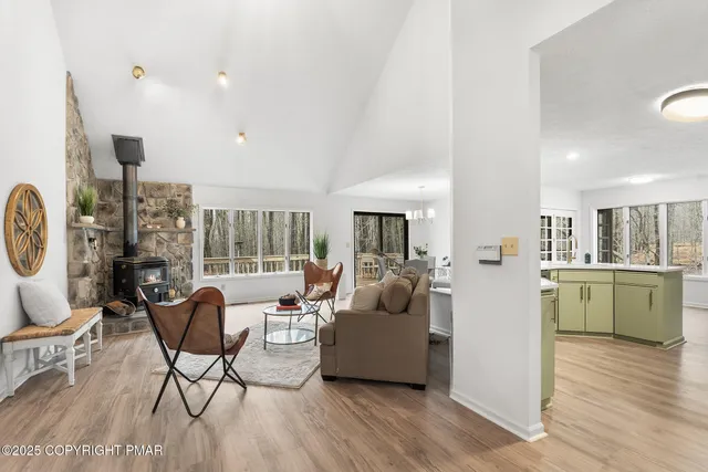 a view of hallway with wooden floor