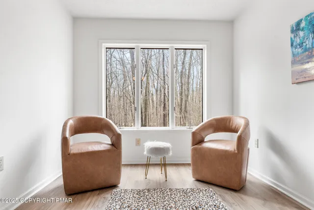 a view of balcony with wooden floor and fence