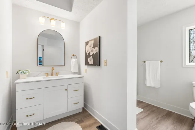 a view of a house with a yard and deck area