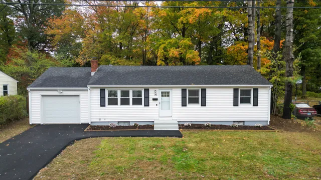 a front view of a house with yard