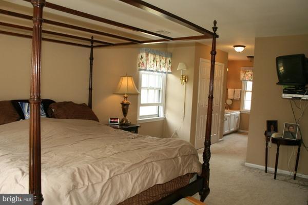 13130 Brandon Way Road Gaithersburg, MD 20878 - Photo 13 of 26 a bedroom with a bed window and a flat screen tv