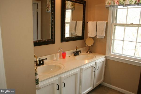 13130 Brandon Way Road Gaithersburg, MD 20878 - Photo 15 of 26 a bathroom with a sink and a mirror