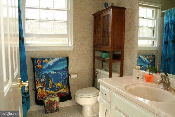 13130 Brandon Way Road Gaithersburg, MD 20878 - Photo 16 of 26 a bathroom with a sink toilet and window