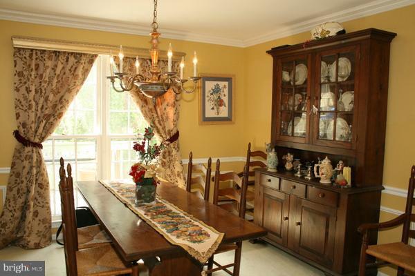 13130 Brandon Way Road Gaithersburg, MD 20878 - Photo 7 of 26 a view of a dining room with furniture and chandelier