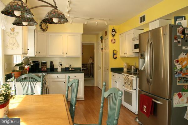 13130 Brandon Way Road Gaithersburg, MD 20878 - Photo 8 of 26 a kitchen with stainless steel appliances granite countertop a refrigerator a stove and a sink