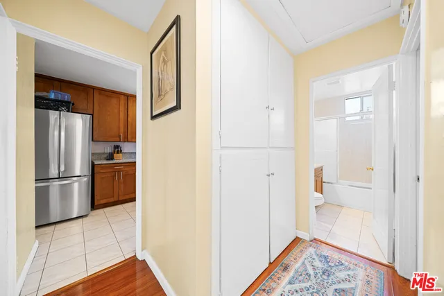 a bedroom with a bed and a desk