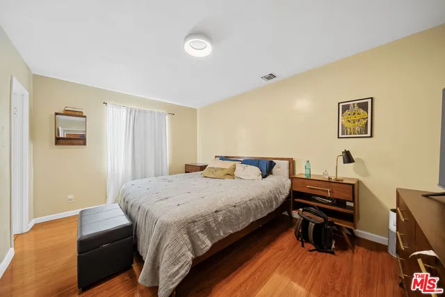 a bedroom with a bed and a view of bedroom