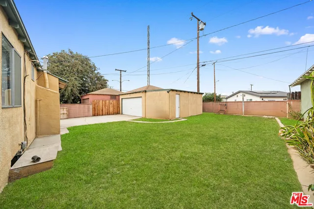 an aerial view of a house with outdoor space