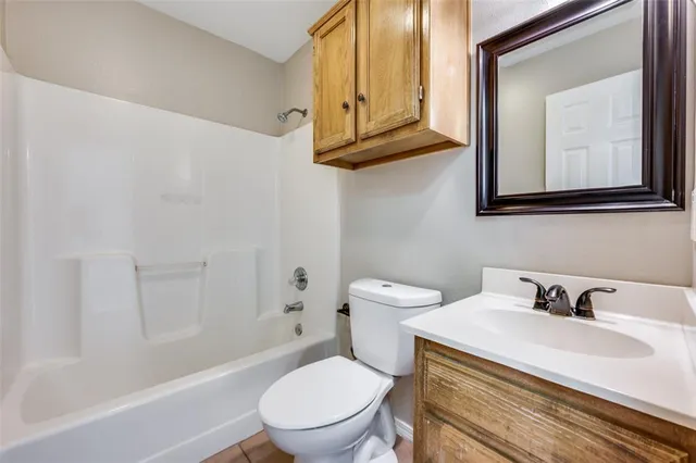 a bathroom with a sink a toilet and a bathtub