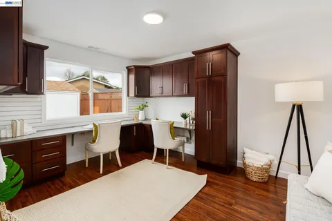 a kitchen with a wooden floor and a sink