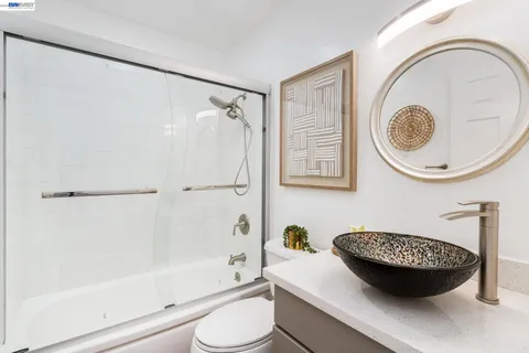 a bathroom with a sink a toilet and a bathtub