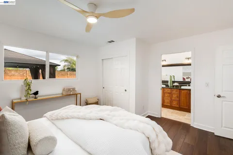 a bedroom with a bed and a walk in closet