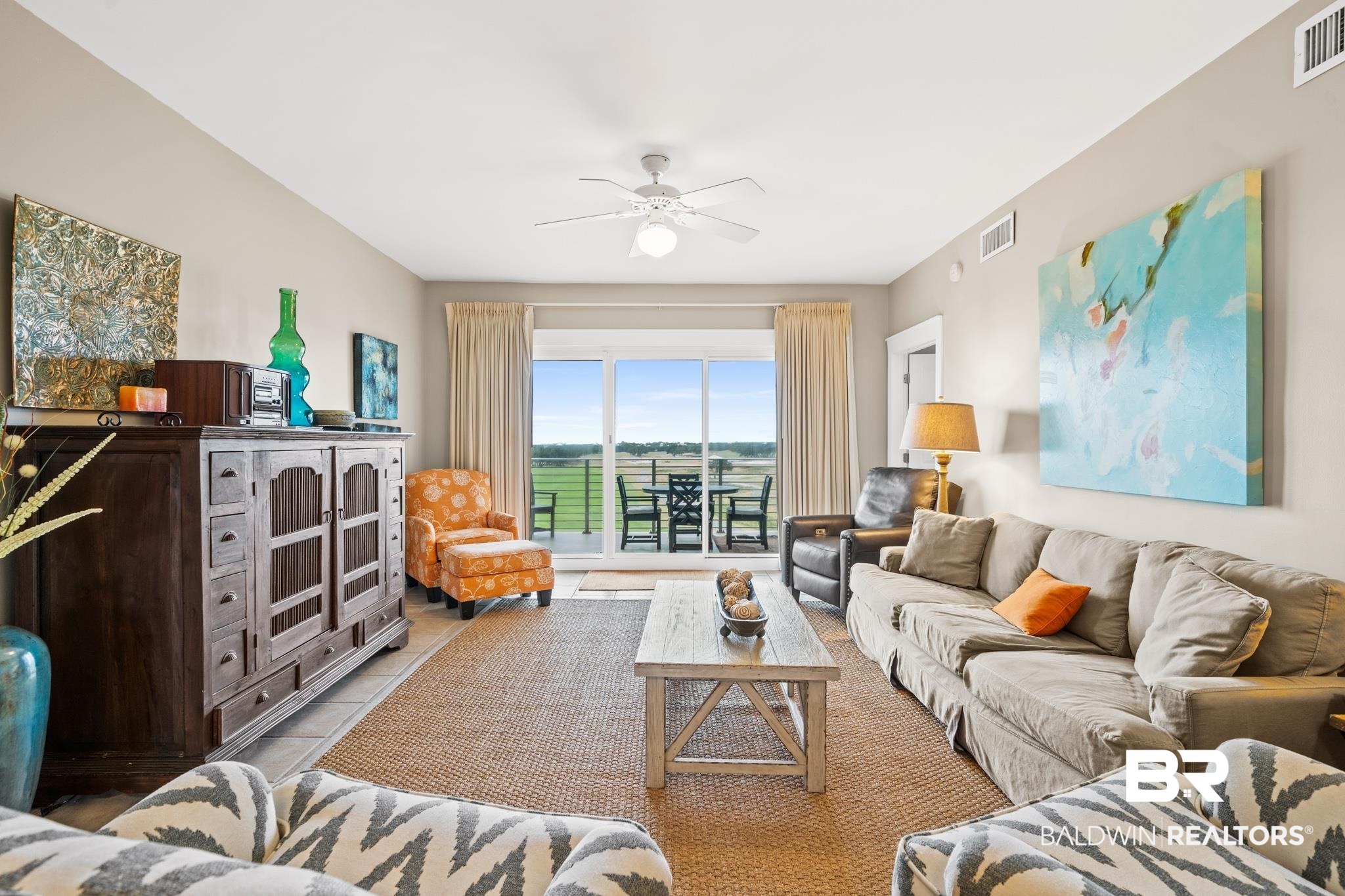 815 Plantation Road, Unit 405 Gulf Shores, AL 36542 - Photo 9 of 39 Tiled living room with ceiling fan