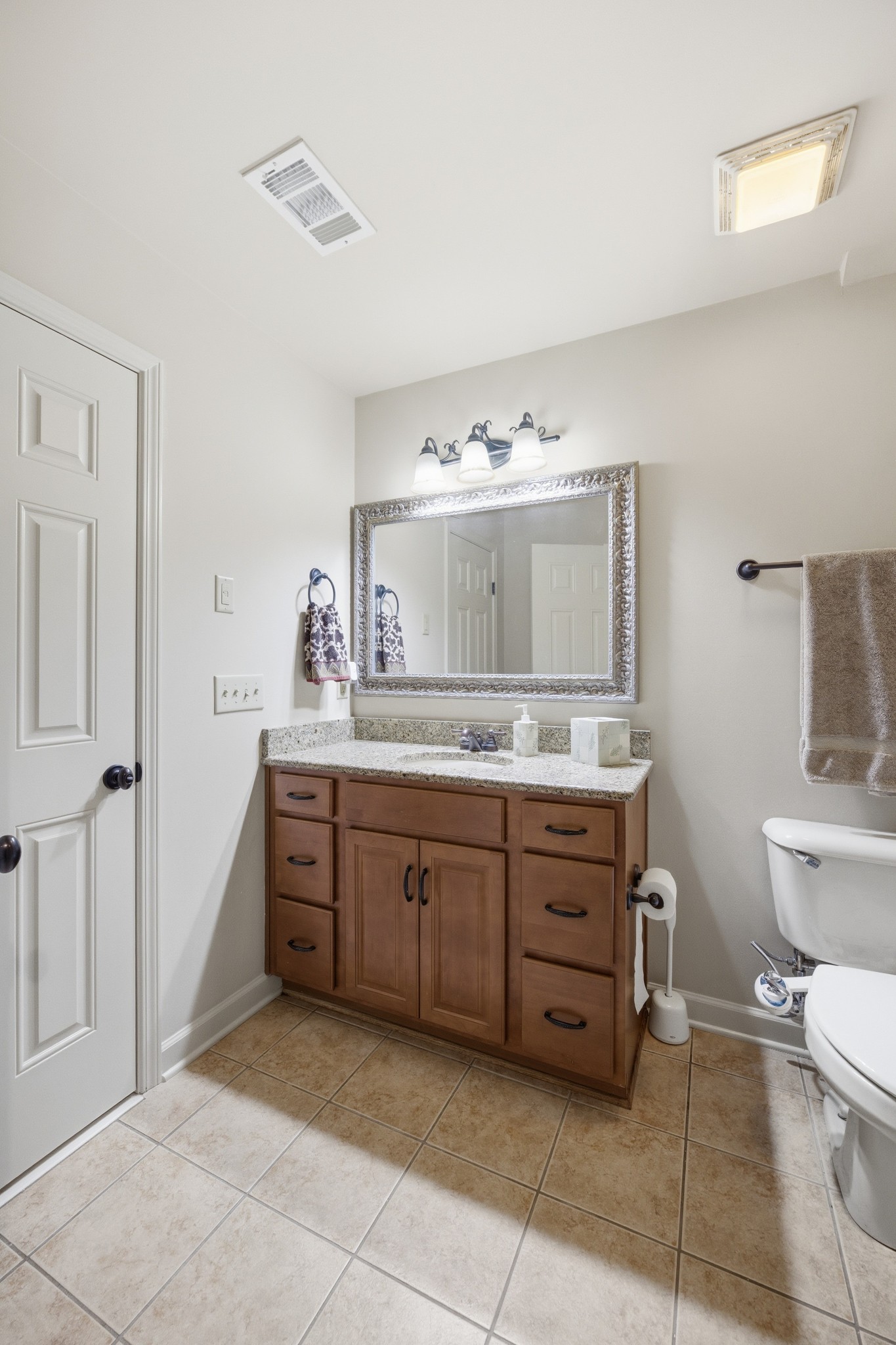 319 Hamlets End Way Franklin, TN 37067 - Photo 43 of 54 a spacious bathroom with a granite countertop sink mirror and toilet