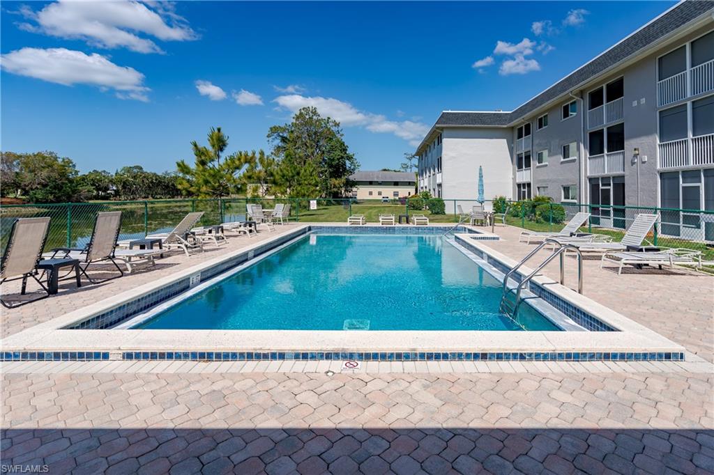 5515 Rattlesnake Hammock Road, Unit 205 Naples, FL 34113 - Photo 23 of 46 a view of a house with swimming pool