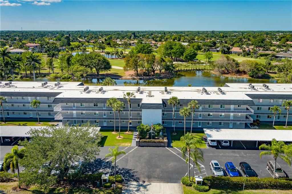 5515 Rattlesnake Hammock Road, Unit 205 Naples, FL 34113 - Photo 26 of 46 a view of a city with lots of trees
