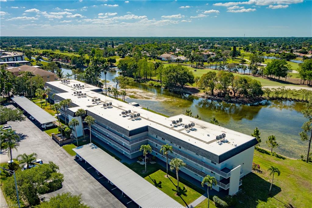 5515 Rattlesnake Hammock Road, Unit 205 Naples, FL 34113 - Photo 28 of 46 an aerial view of a city with ocean view