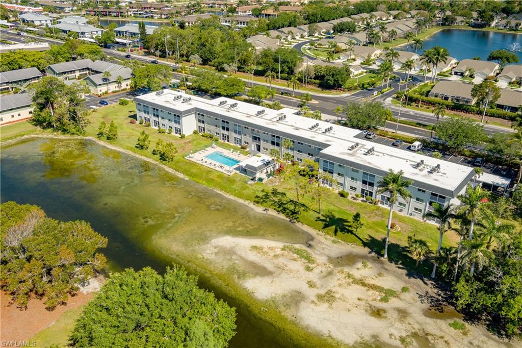 5515 Rattlesnake Hammock Road, Unit 205 Naples, FL 34113 - Photo 32 of 46 an aerial view of residential houses with outdoor space