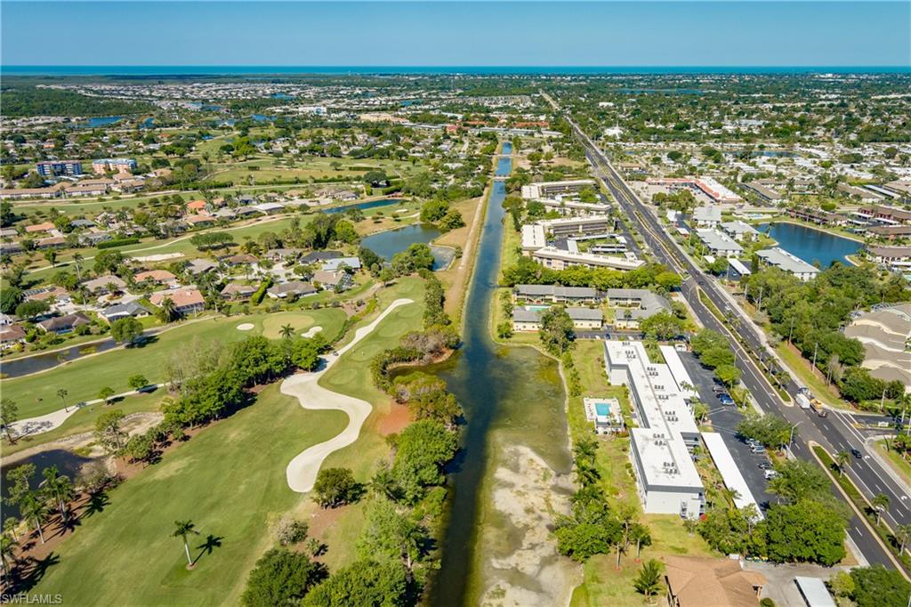 5515 Rattlesnake Hammock Road, Unit 205 Naples, FL 34113 - Photo 38 of 46 an aerial view of residential houses with outdoor space