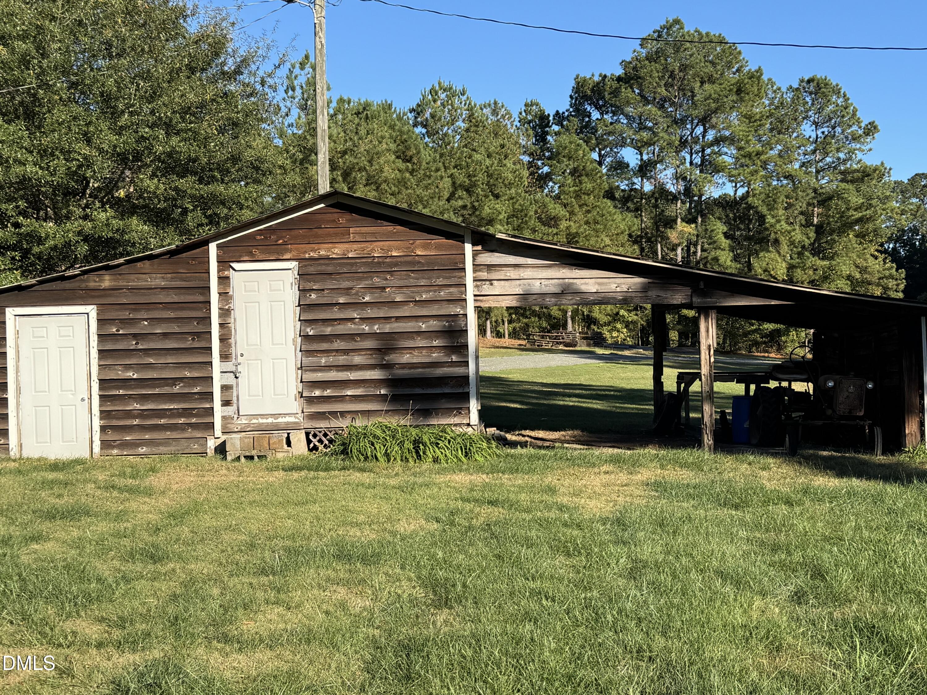 15008 Creedmoor Road Wake Forest, NC 27587 - Photo 11 of 14 a view of a house with a yard