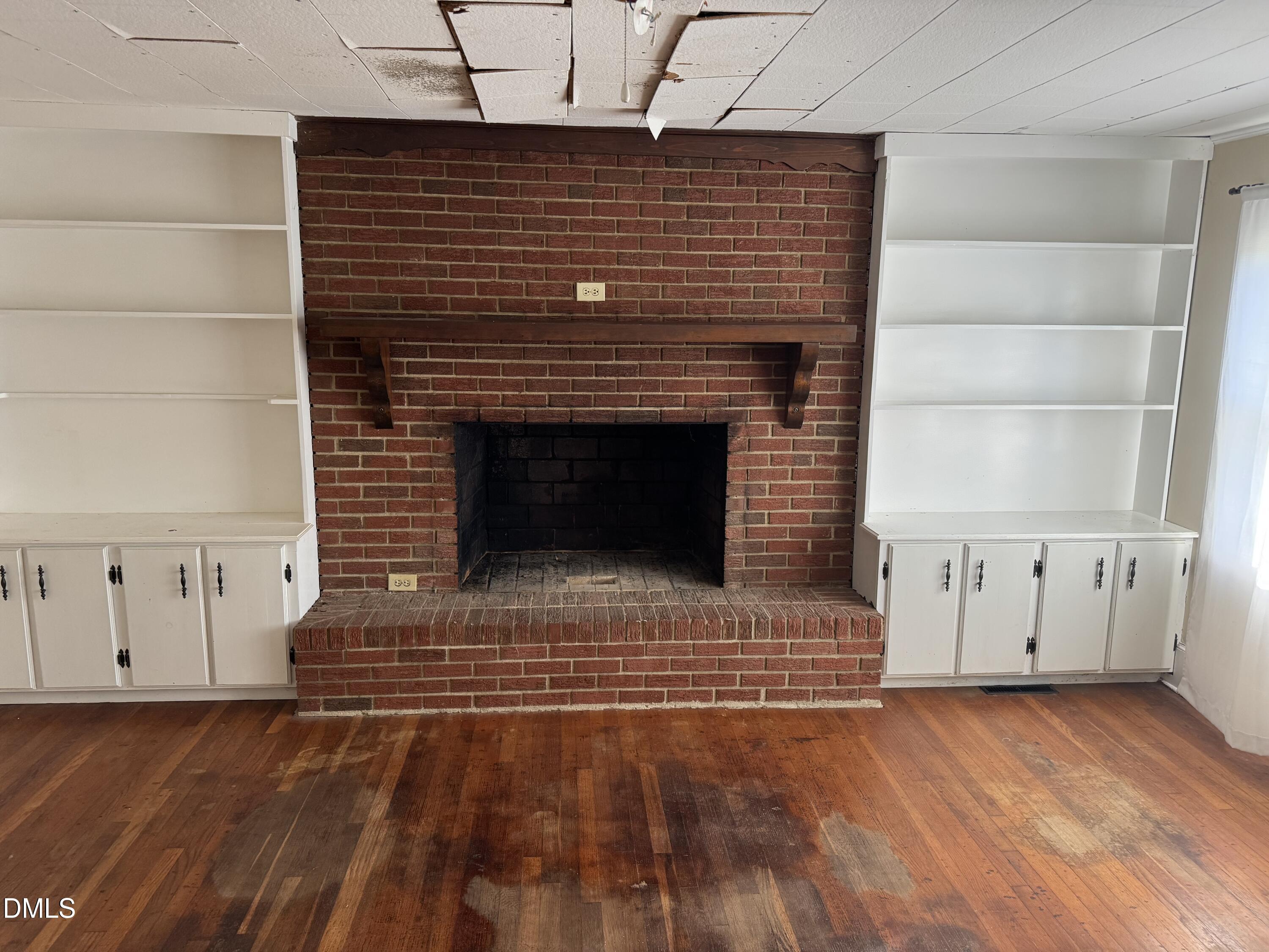 15008 Creedmoor Road Wake Forest, NC 27587 - Photo 4 of 14 a view of fireplace and wooden floor