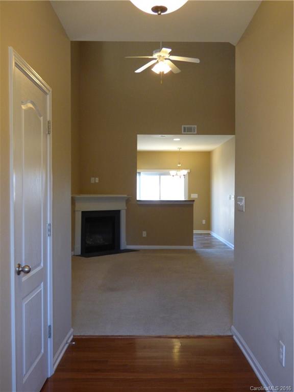 1249 Afternoon Sun Road Matthews, NC 28104 - Photo 2 of 20 a view of a hallway with wooden floor and a sink