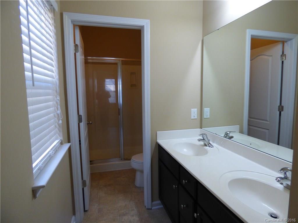 1249 Afternoon Sun Road Matthews, NC 28104 - Photo 12 of 20 a bathroom with a sink double vanity and a mirror