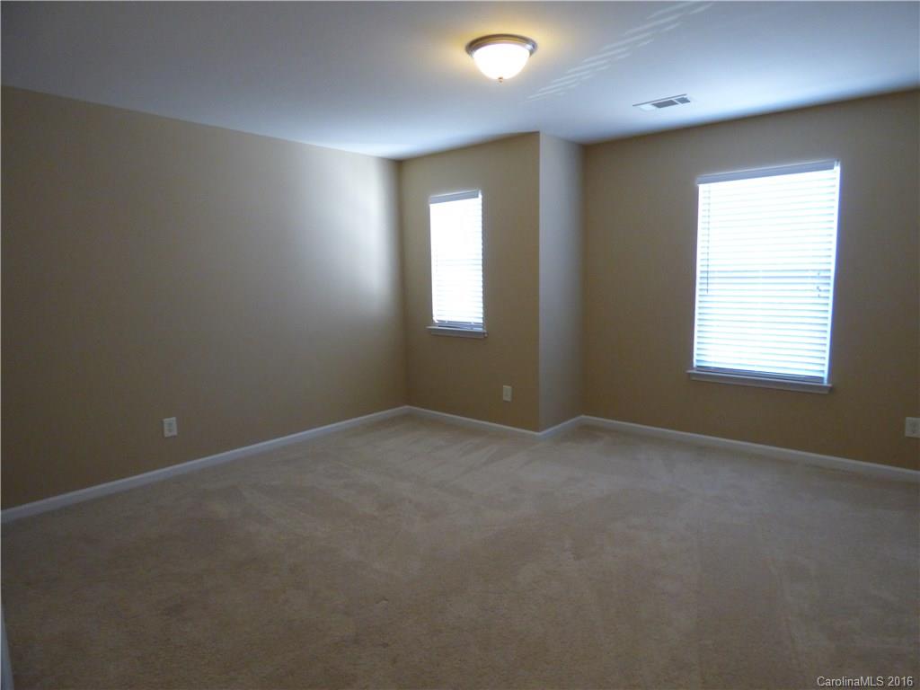 1249 Afternoon Sun Road Matthews, NC 28104 - Photo 14 of 20 an empty room with windows