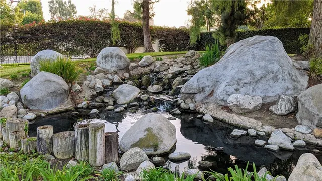 a view of a garden with a fountain