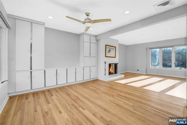 a kitchen with stainless steel appliances granite countertop a stove top oven a sink and a refrigerator