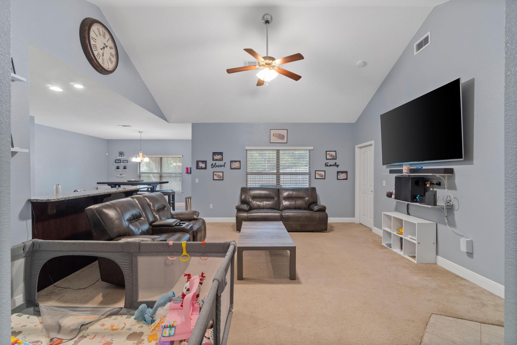 641 Red Fern Road Crestview, FL 32536 - Photo 12 of 33 a living room with furniture and a flat screen tv