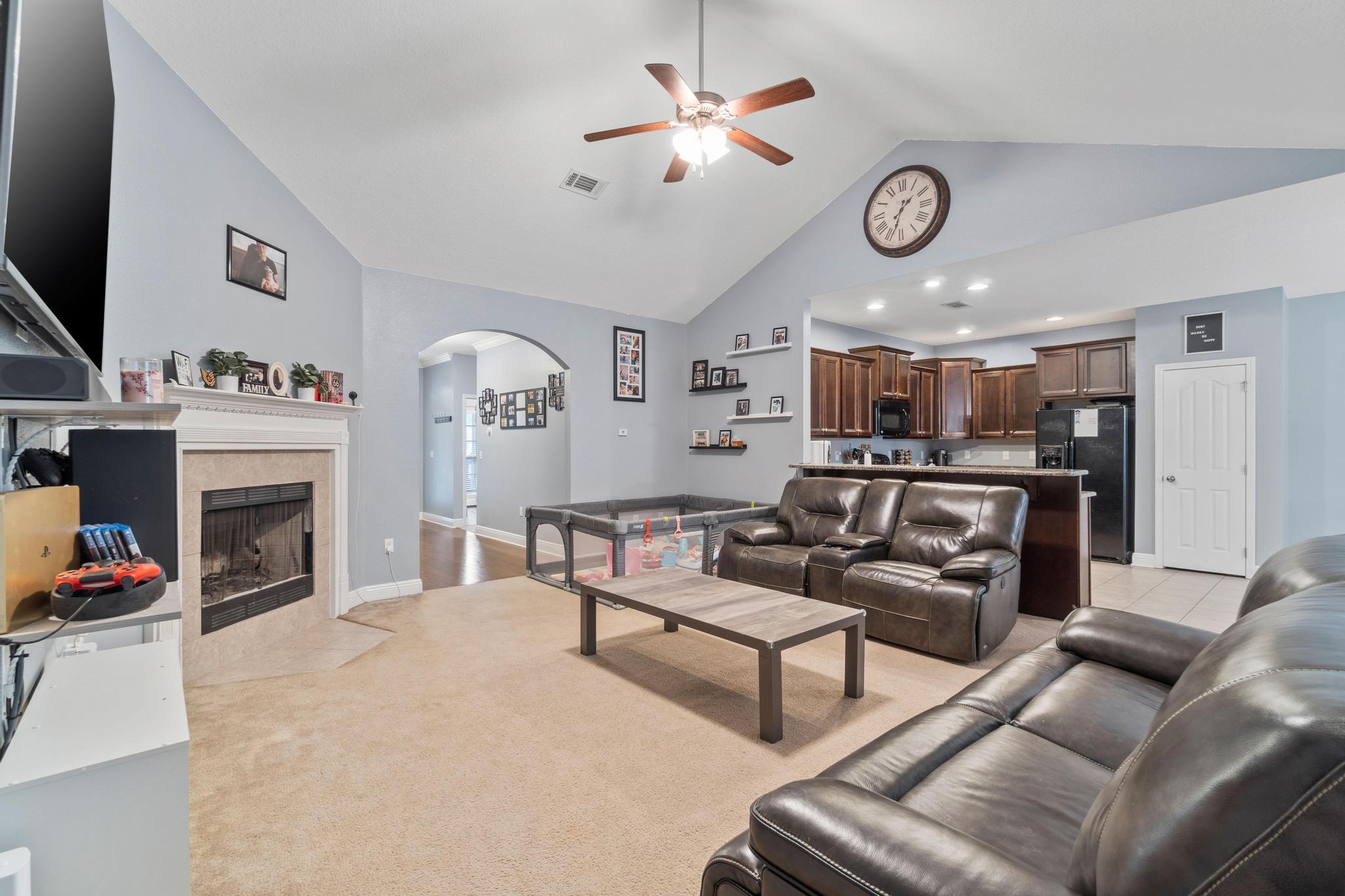 641 Red Fern Road Crestview, FL 32536 - Photo 13 of 33 a living room with furniture and a fireplace