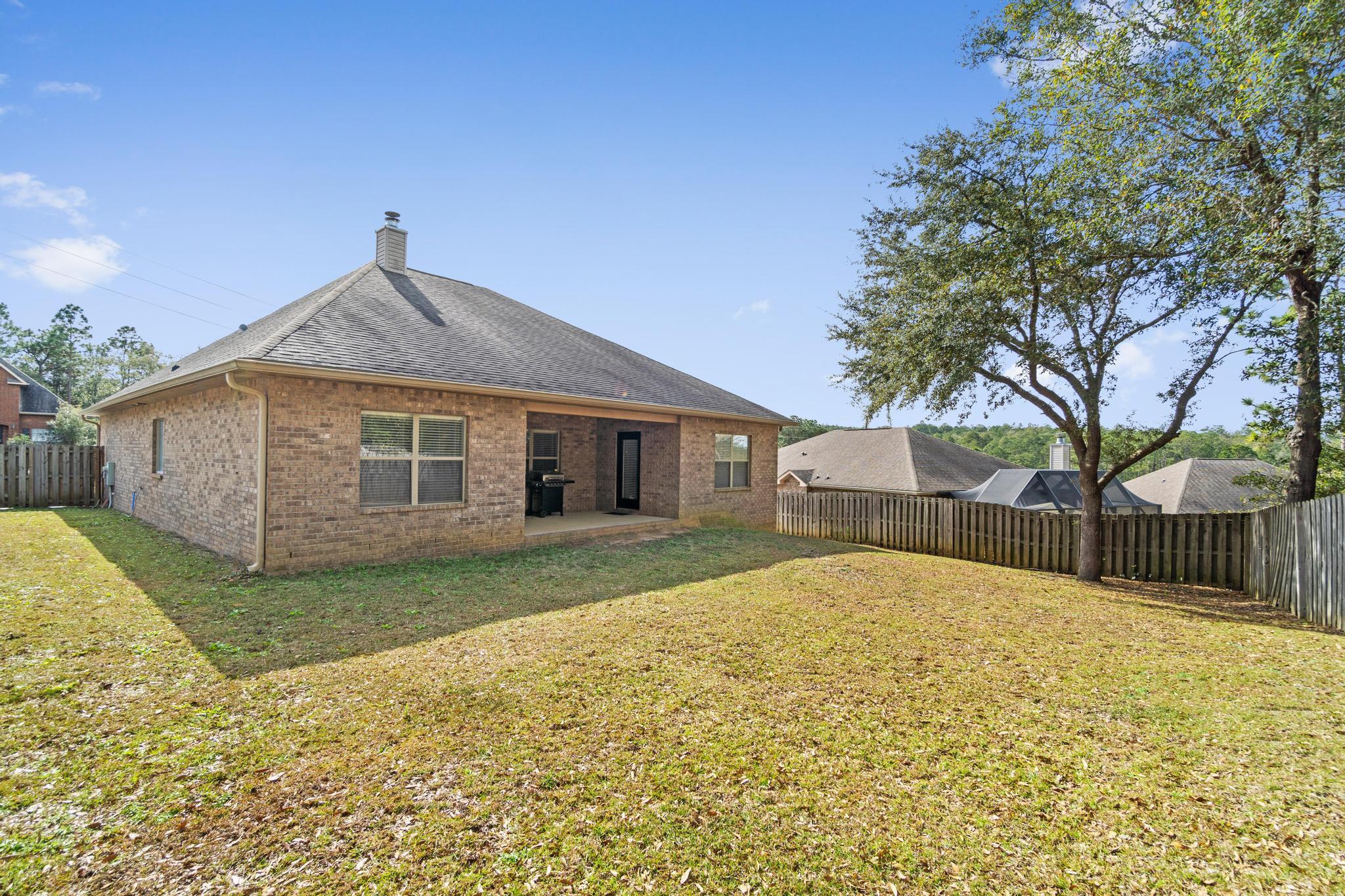 641 Red Fern Road Crestview, FL 32536 - Photo 31 of 33 a front view of house with yard and trees