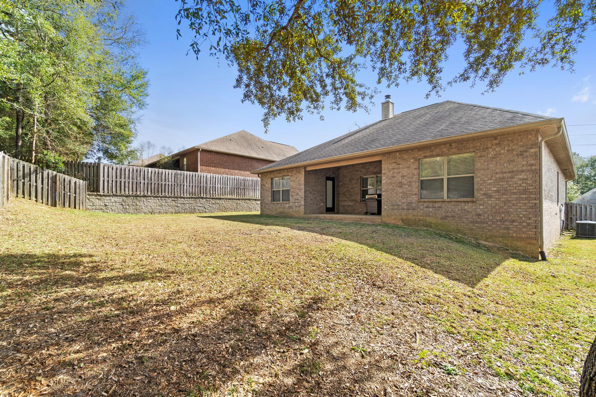 641 Red Fern Road Crestview, FL 32536 - Photo 32 of 33 a front view of a house with a yard