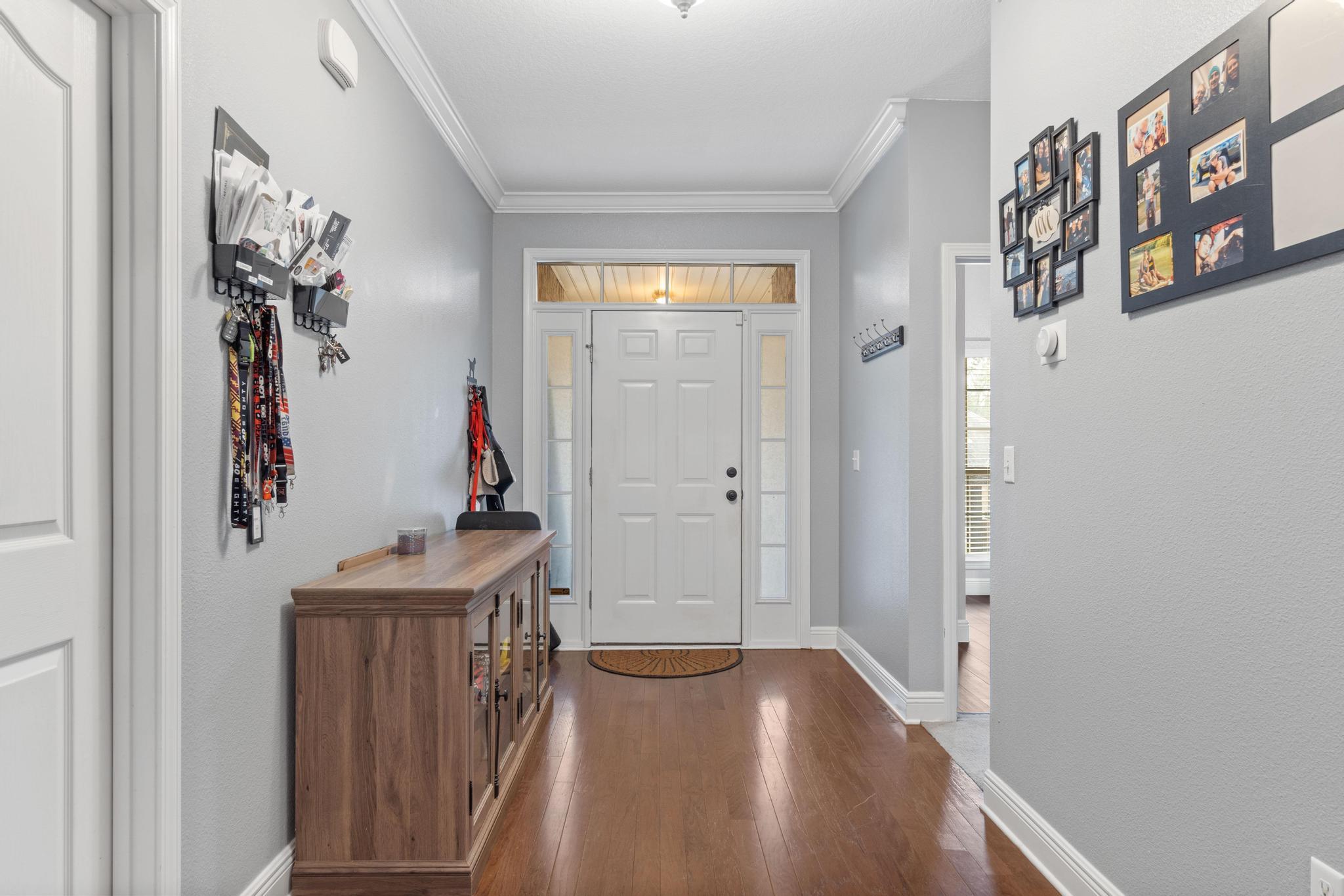 641 Red Fern Road Crestview, FL 32536 - Photo 5 of 33 a view of hallway with livingroom and furniture