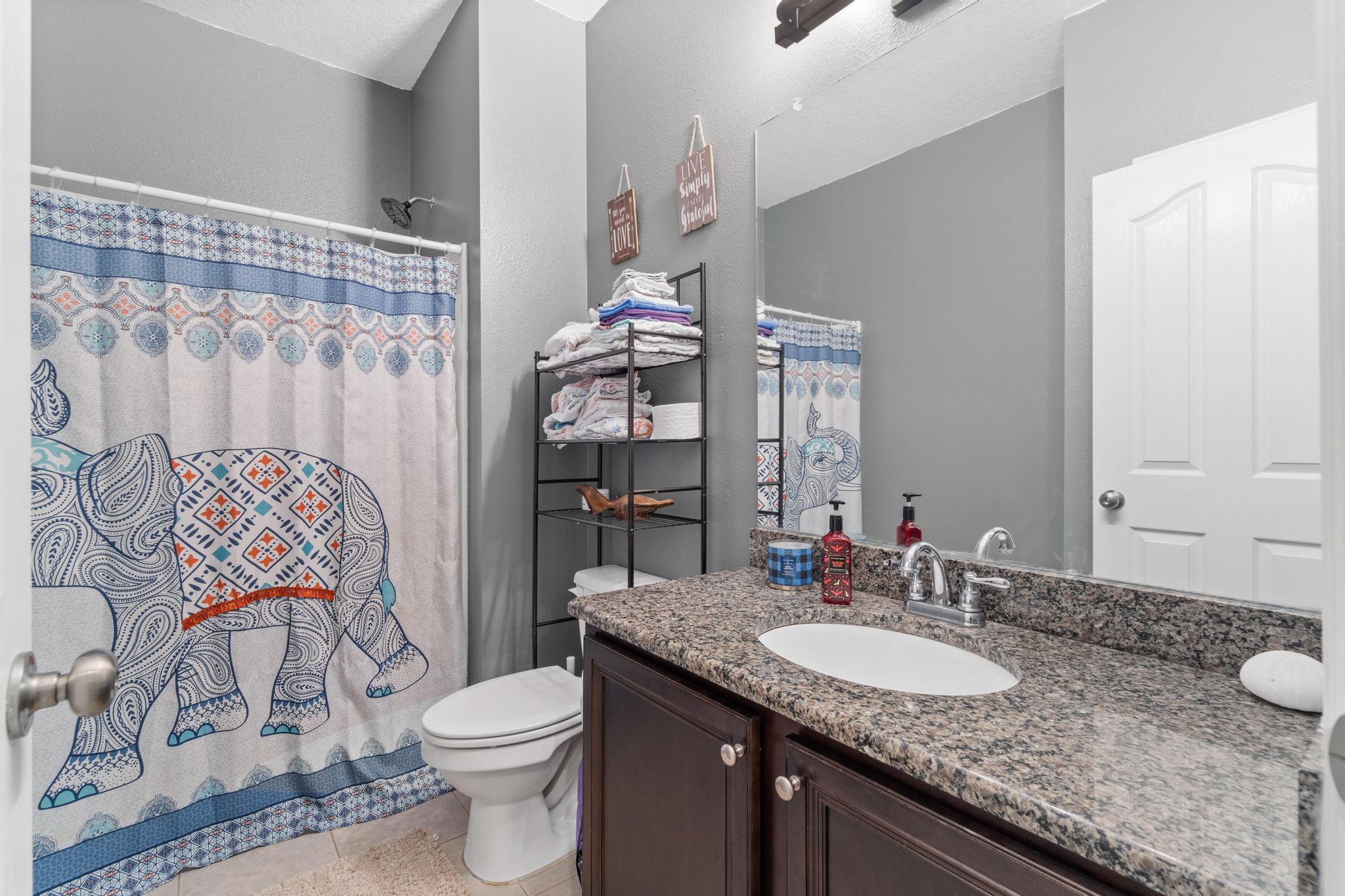 641 Red Fern Road Crestview, FL 32536 - Photo 9 of 33 a bathroom with a granite countertop sink and a mirror with toilet
