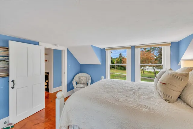 a bedroom with a bed and a fireplace